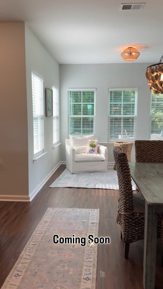 A bright, staged living space inside one of Andrea's coming-soon listings
